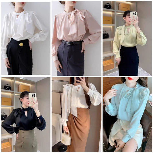 long-sleeved blouse with a stand collar and a delicate bow accent at the neckline, paired with a stylish wrap